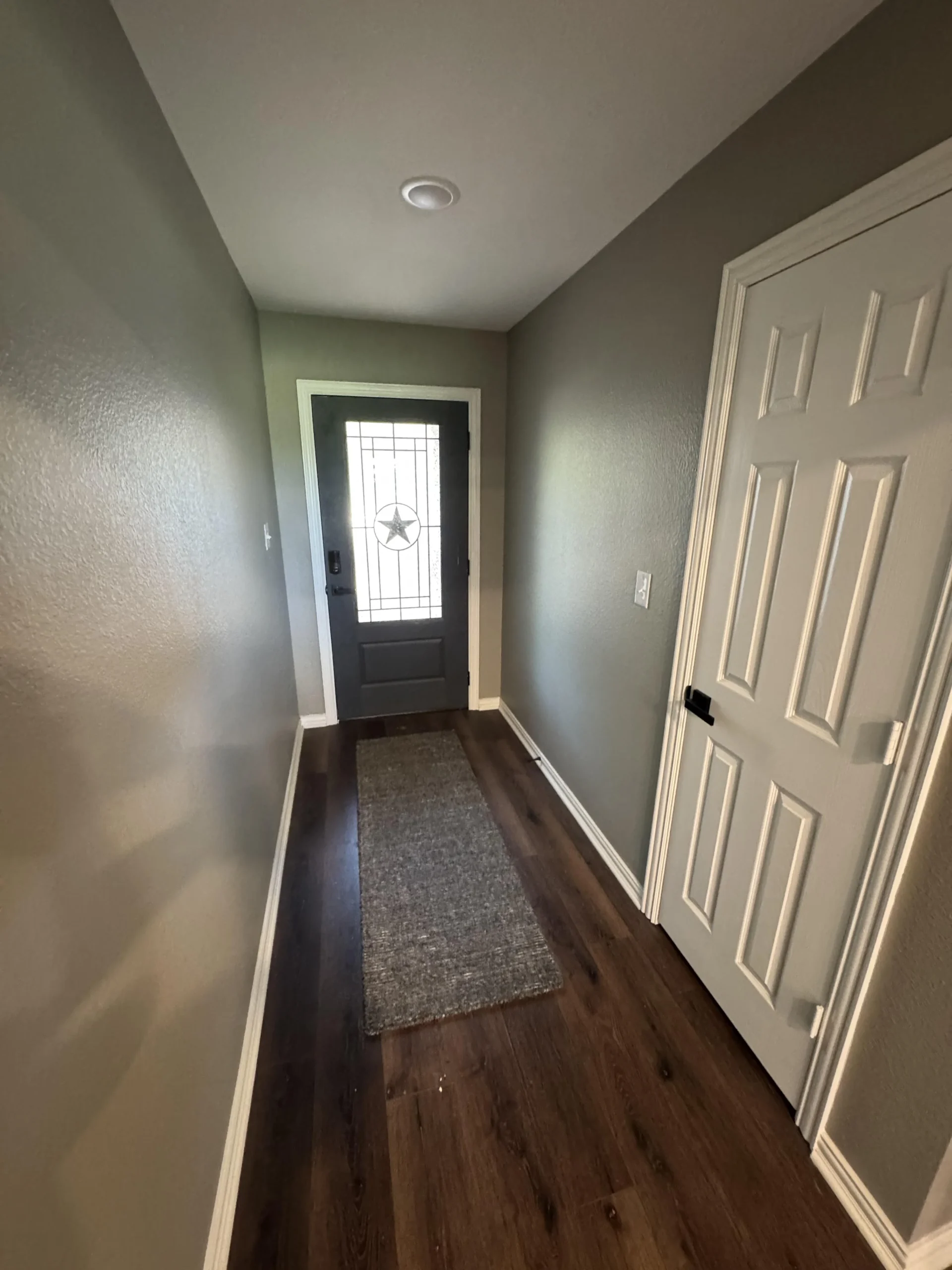 Restored entryway with new wood flooring after fire damage restoration in Frisco, TX by Mr. Restore